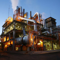 A sprawling gas industry plant with numerous pipes and structures